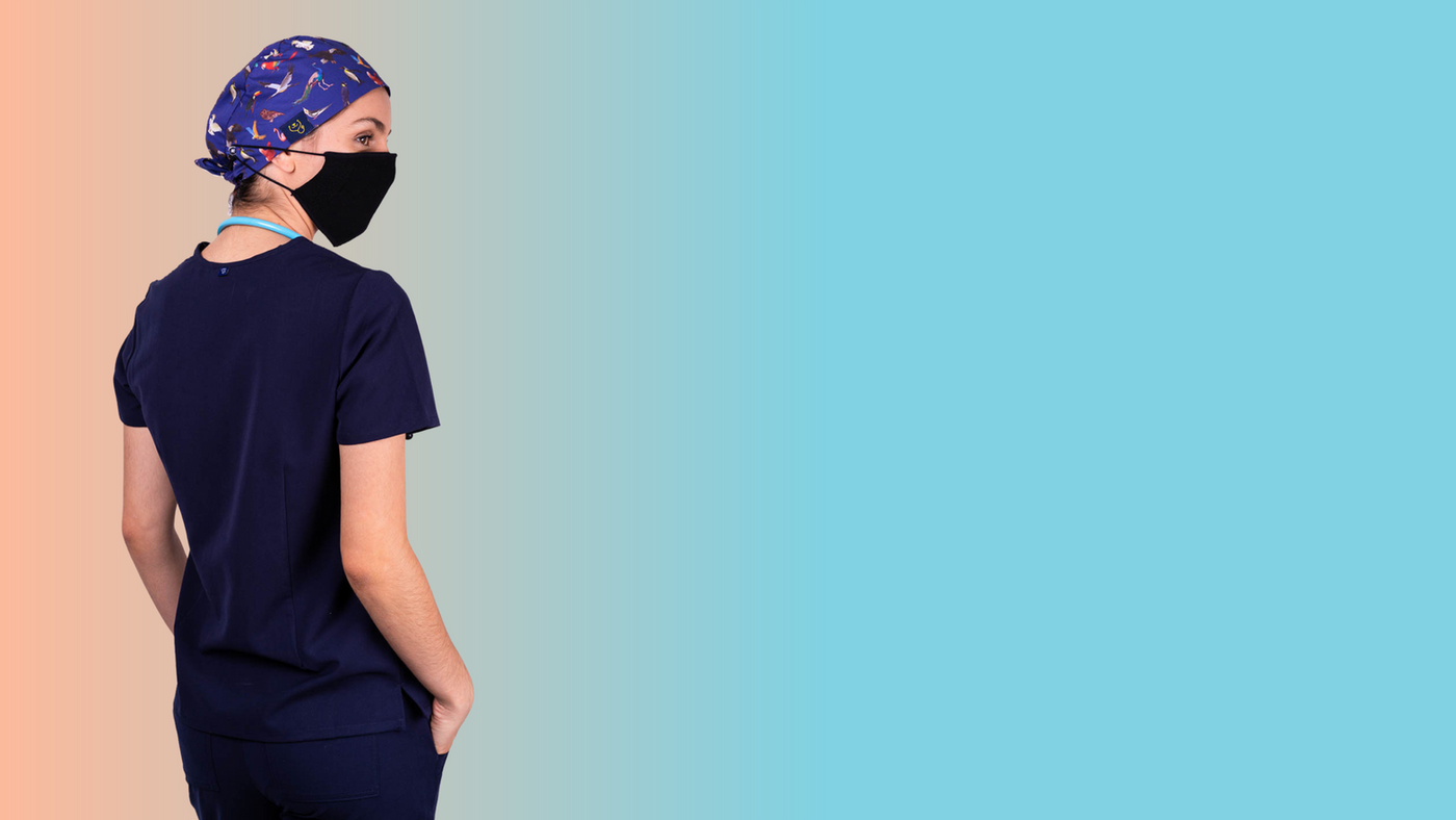 Healthcare worker wearing a Custom Surgical Scrub Cap and Custom Scrubs