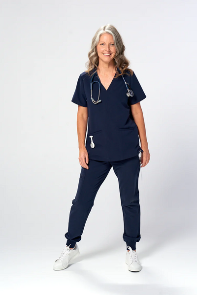 Veterinarian wearing a navy scrub uniform