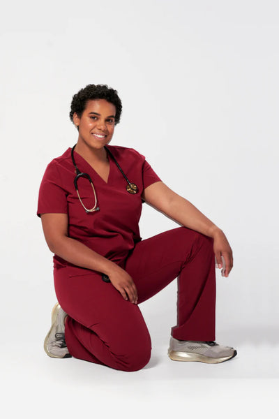 Dentist wearing a Dr. Scrub Uniform in Burgundy