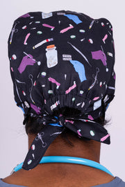 A Doctor Wearing a Dr. Woof Sugar Skulls Anesthesia Surgical Scrub Cap 