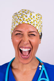 A Doctor Wearing a Dr. Woof Peanuts Woodstock Surgical Scrub Cap