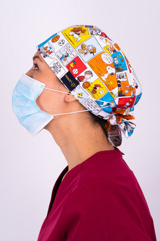 A Med Tech Wearing a Dr. Woof Peanuts Good Sport Surgical Scrub Cap