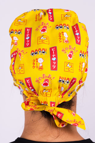 A Dentist Wearing a Dr. Woof Peanuts Japan Surgical Scrub Cap