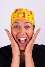 A Dentist Wearing a Dr. Woof Peanuts Japan Surgical Scrub Cap
