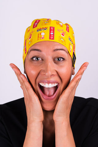 A Dentist Wearing a Dr. Woof Peanuts Japan Surgical Scrub Cap