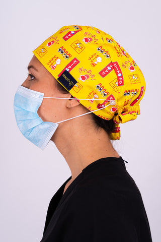 A Vet Wearing a Dr. Woof Peanuts Japan Surgical Scrub Cap