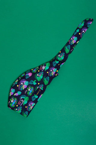 A Dr. Woof Peanuts Aloha Disco Surgical Scrub Cap