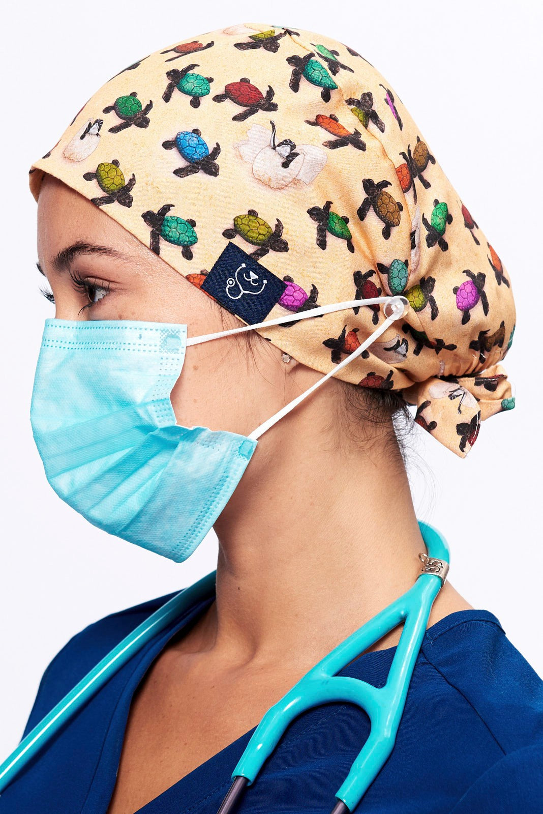 A Doctor wearing a Dr. Woof Sea Turtle Surgical Scrub Cap Tie Back