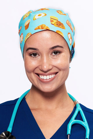 A Nurse wearing a Dr. Woof Brunch Bae Surgical Scrub Cap  Tie Back
