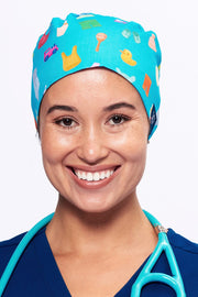 A Pediatrician wearing a Dr. Woof Goo Goo Gaa Gaa Surgical Scrub Cap Tie Back