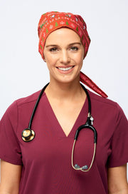 A Nurse wearing a Dr. Woof Peanuts Christmas Surgical Scrub Cap