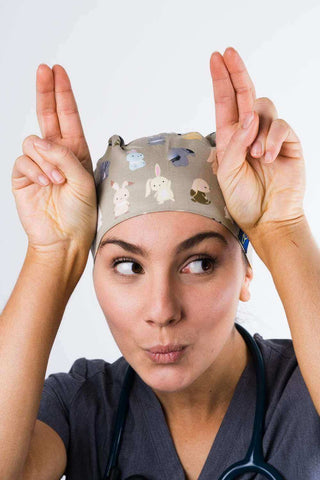 A Nurse Wearing a Dr. Woof Bunnies Surgical Scrub Cap Tie Back