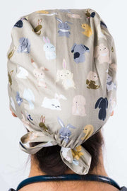 A Nurse Wearing a Dr. Woof Bunnies Surgical Scrub Cap 