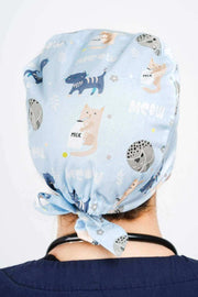A Doctor Wearing a Dr. Woof Quirky Cats Surgical Scrub Cap