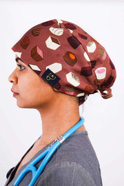 A Nurse Wearing a Dr. Woof Chocolates Surgical Scrub Cap