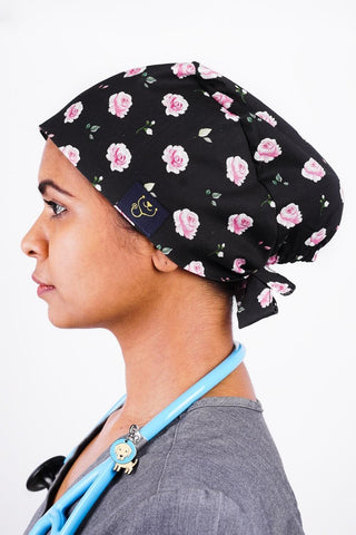 A Vet Nurse Wearing a Dr. Woof Black Roses Surgical Scrub Cap 