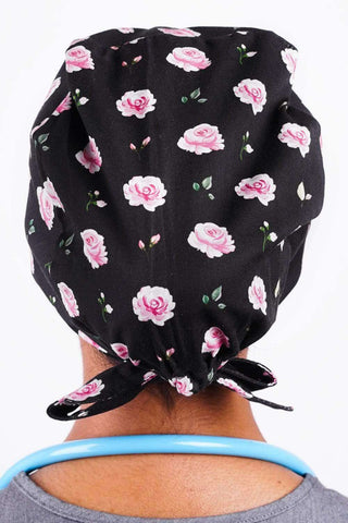 A Vet Wearing a Dr. Woof Black Roses Surgical Scrub Cap