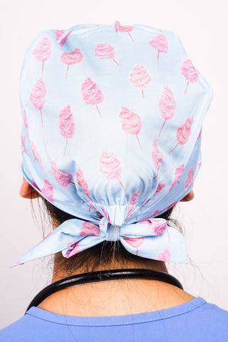 A Nurse Wearing a Dr. Woof Fairy Floss Surgical Scrub Cap