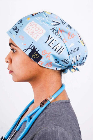 A Doctor Wearing a Dr. Woof Good Vibes Surgical Scrub Cap