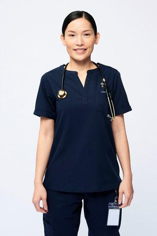 Nurse wearing a Dr. Woof Women's Short Sleeve Henley Scrub Top