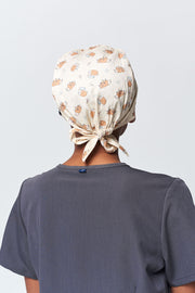 A Dentist Wearing a Dr. Woof Little Hedgehog Surgical Scrub Cap Tie Back