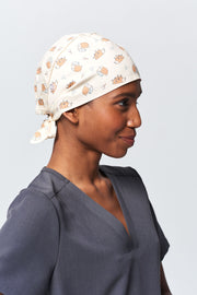 A Dentist Wearing a Dr. Woof Little Hedgehog Surgical Scrub Cap Tie Back