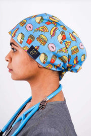 A Dentist Wearing a Dr. Woof Junk Food Surgical Scrub Cap