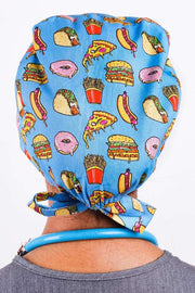 A Nurse Wearing a Dr. Woof Junk Food Surgical Scrub Cap 